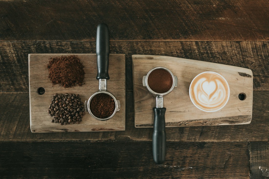 Coffee beans and latte on a wooden board