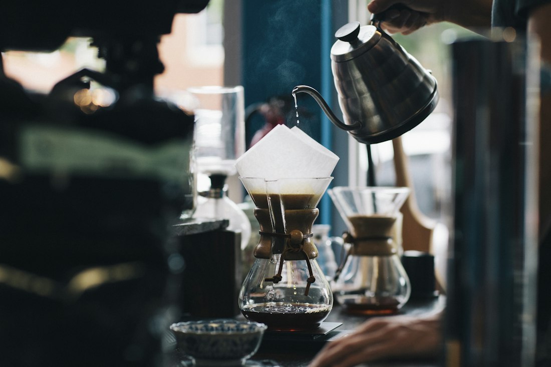 Barista pouring filter coffee