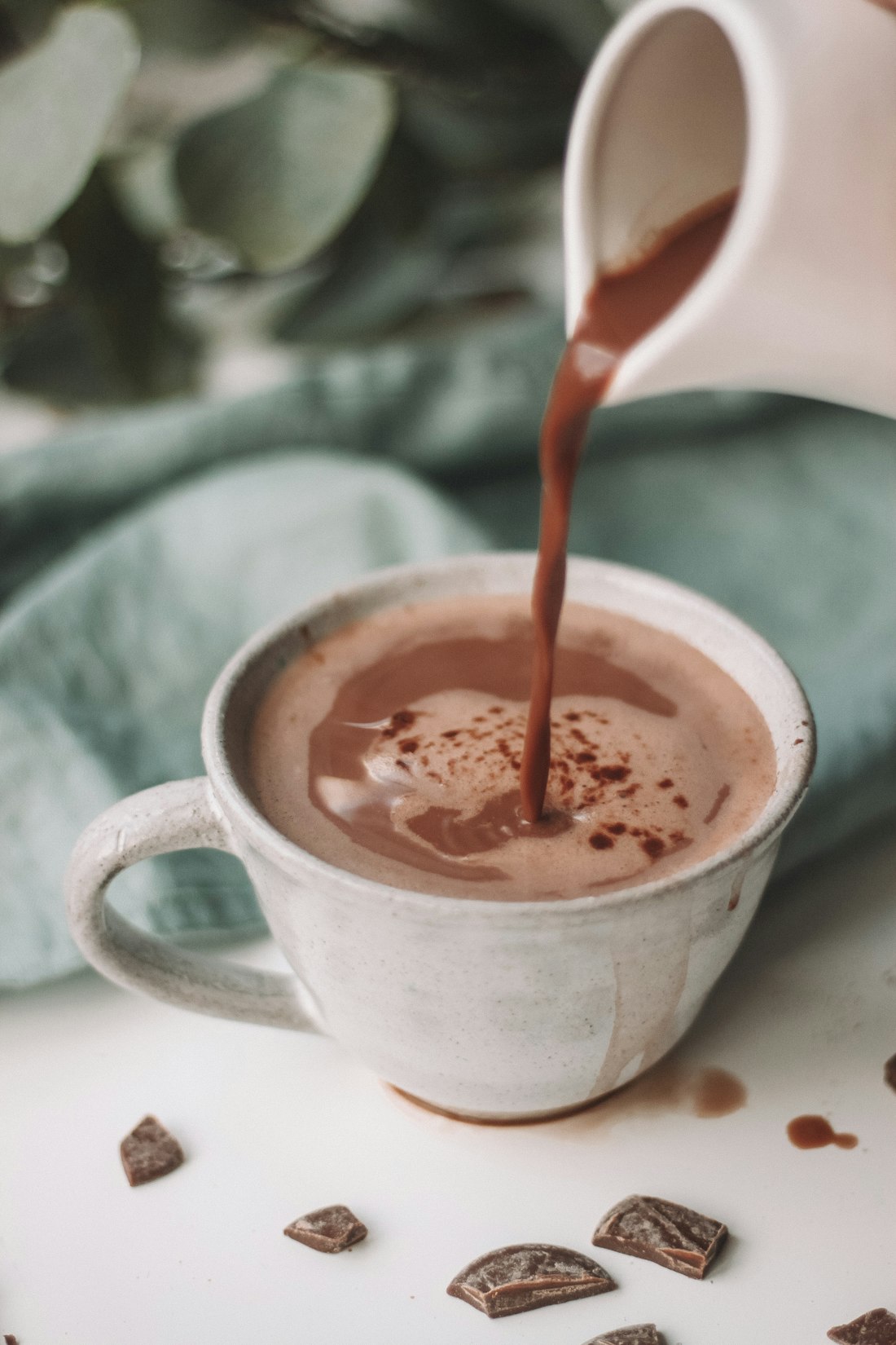 Hot chocolate being poured into a cup